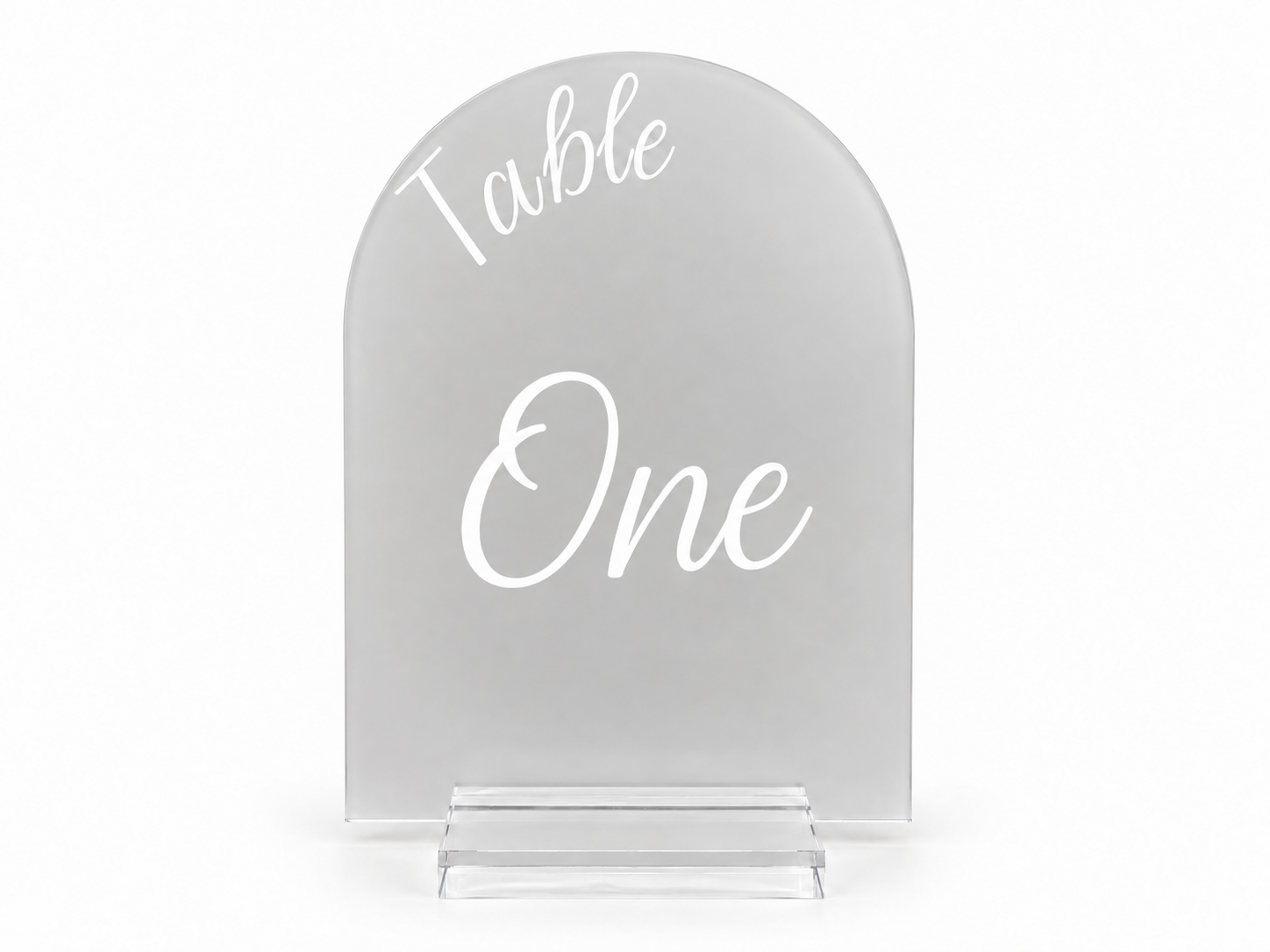 Clear acrylic table sign reading Table One in white script