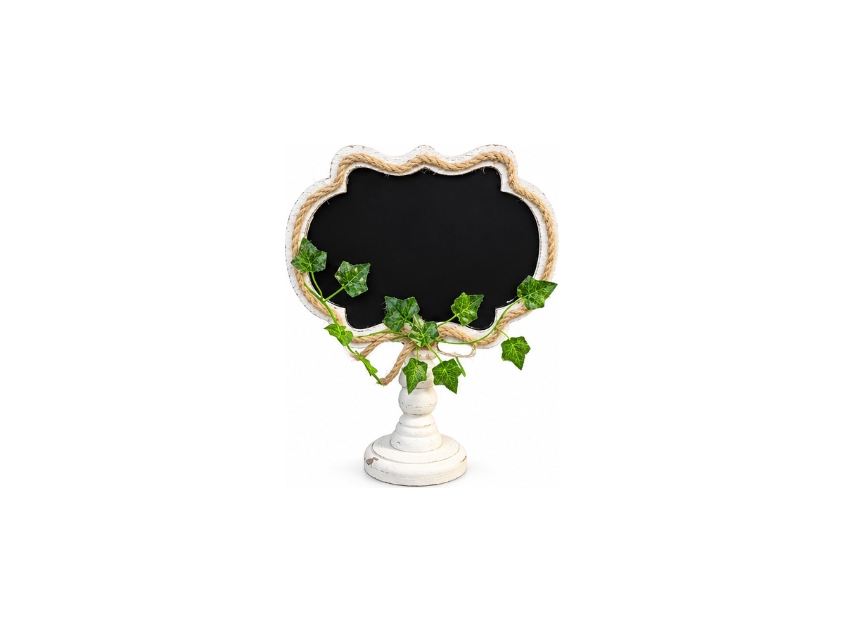 Chalkboard sign in a white decorative frame with greenery